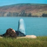 person staring calmly up at the sky