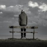 person under a cloudy sky