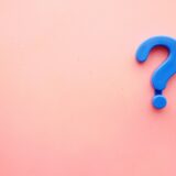 blue question mark on a pink background